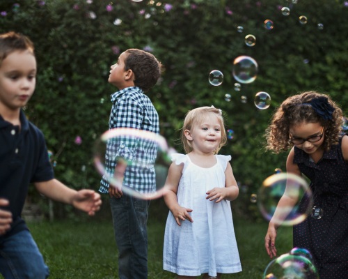 Children playing with bubbles