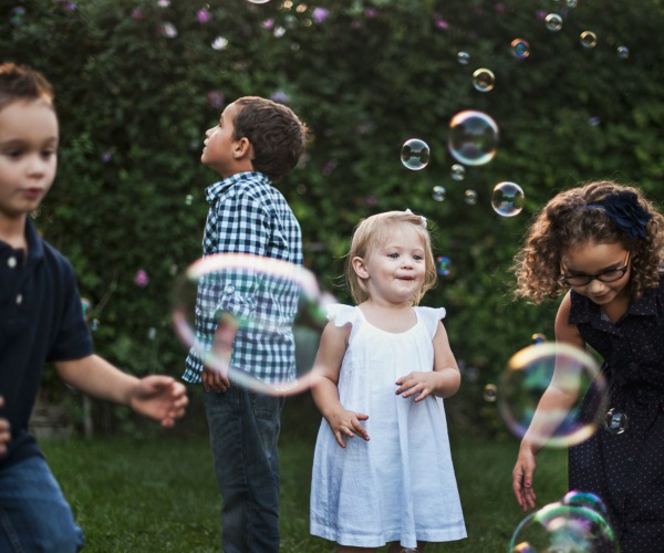 Children playing with bubbles