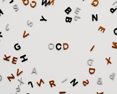 plastic letters on a board spell out OCD