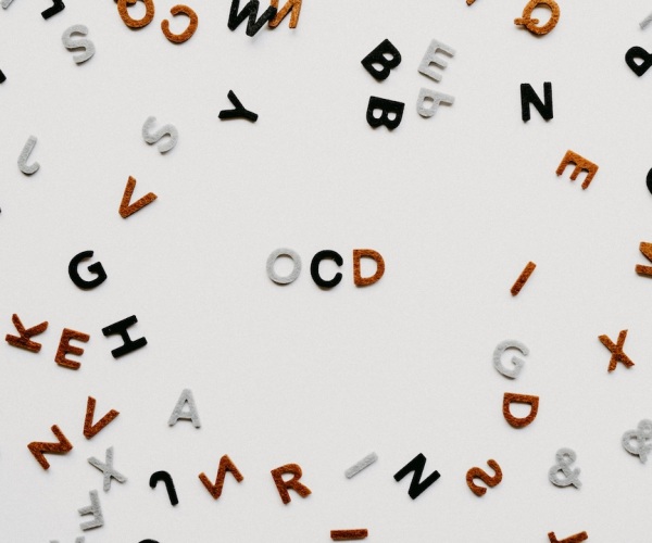 plastic letters on a board spell out OCD